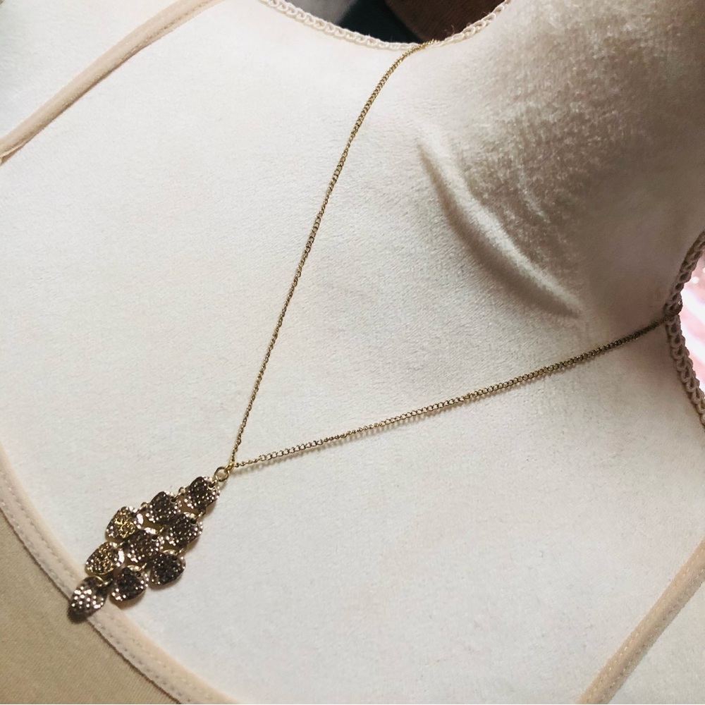Shiny gold waterfall articulated pendant on chain necklace